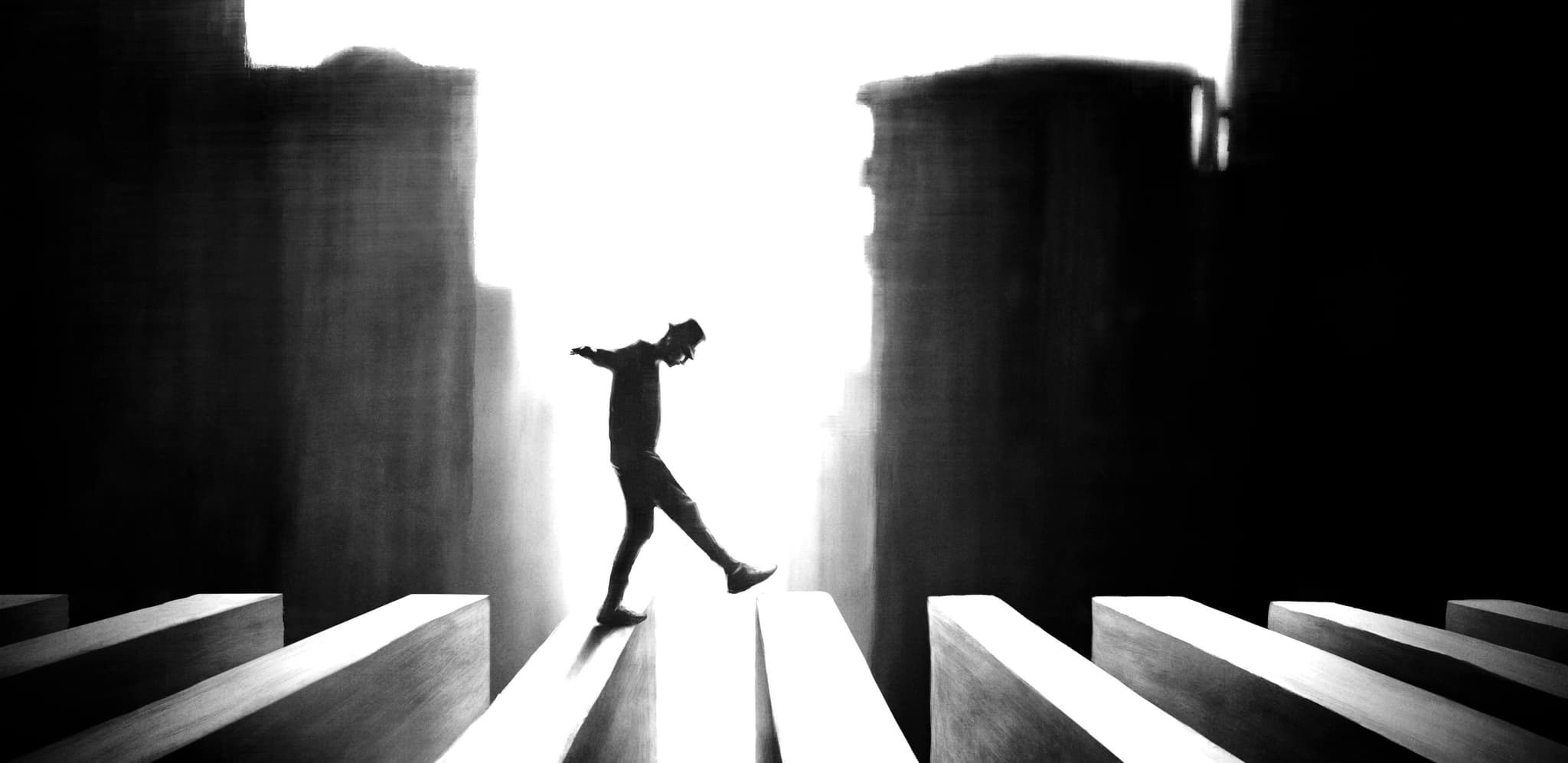 Black and white image of a person walking over stepping stones