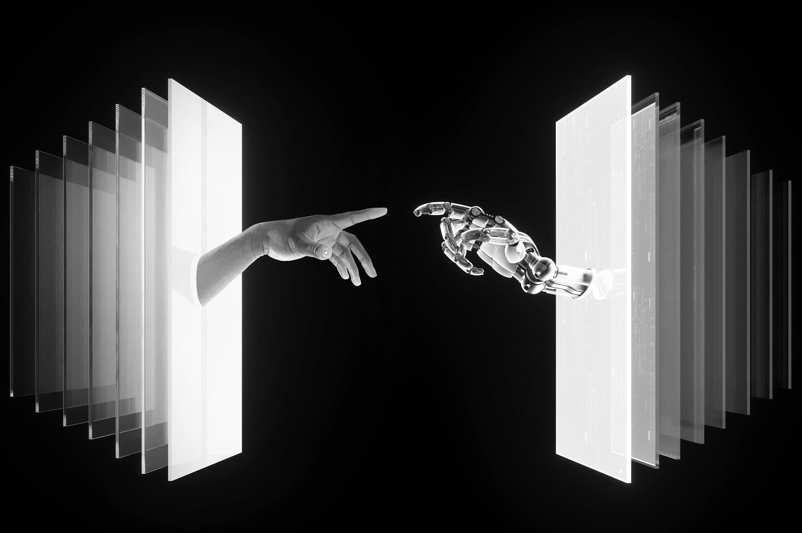 A robot hand reaching to touch a human hand