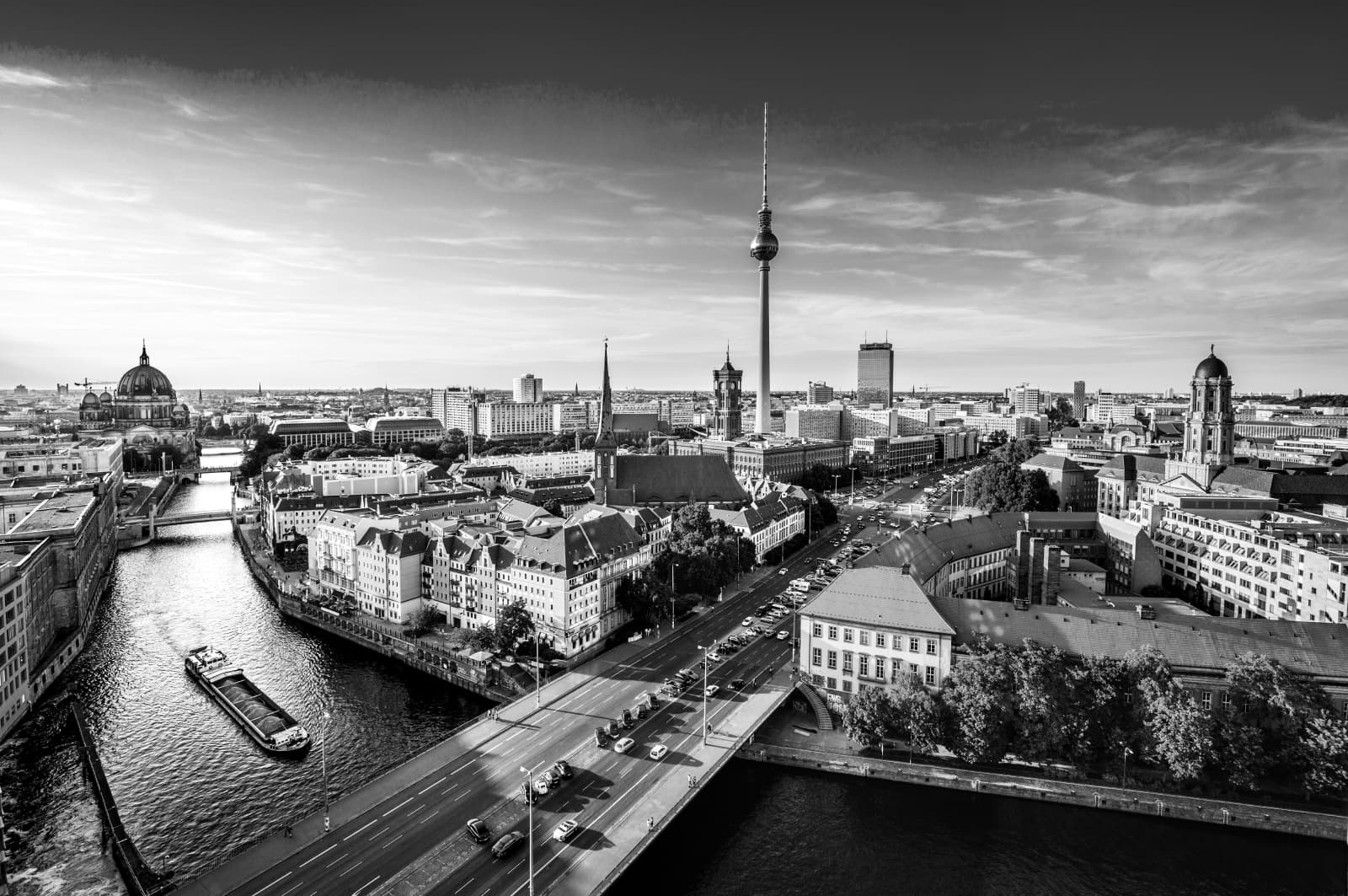 Aerial view of Berlin skyline with famous TV tower and Spree river in beautiful evening light at sunset, Germany.