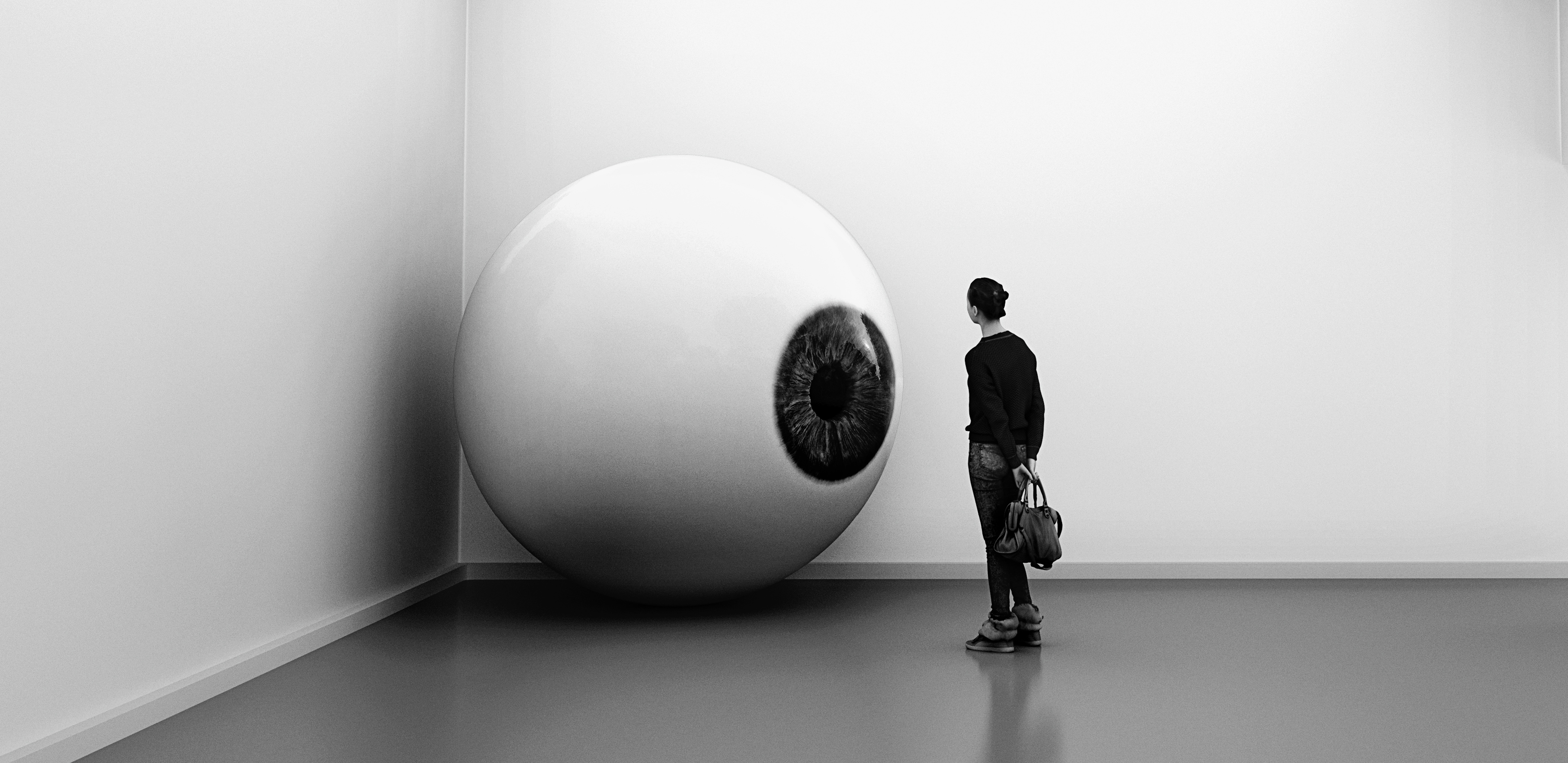 A person looking at a sculpture of an eyeball